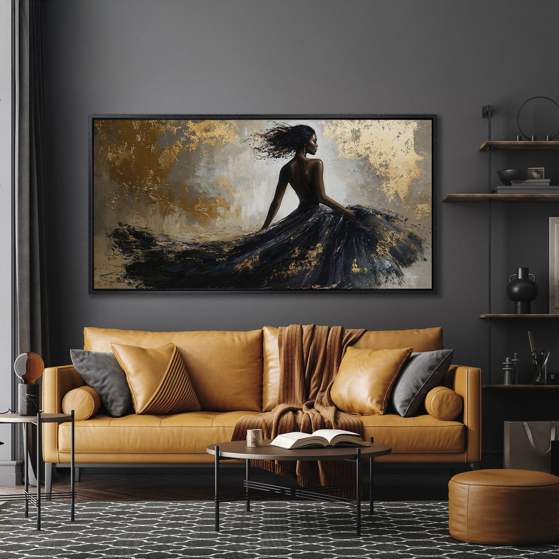 Framed Wall Art: Abstract woman in black dress with gold accents. Modern art canvas print in a dark, moody interior with a warm color palette.
