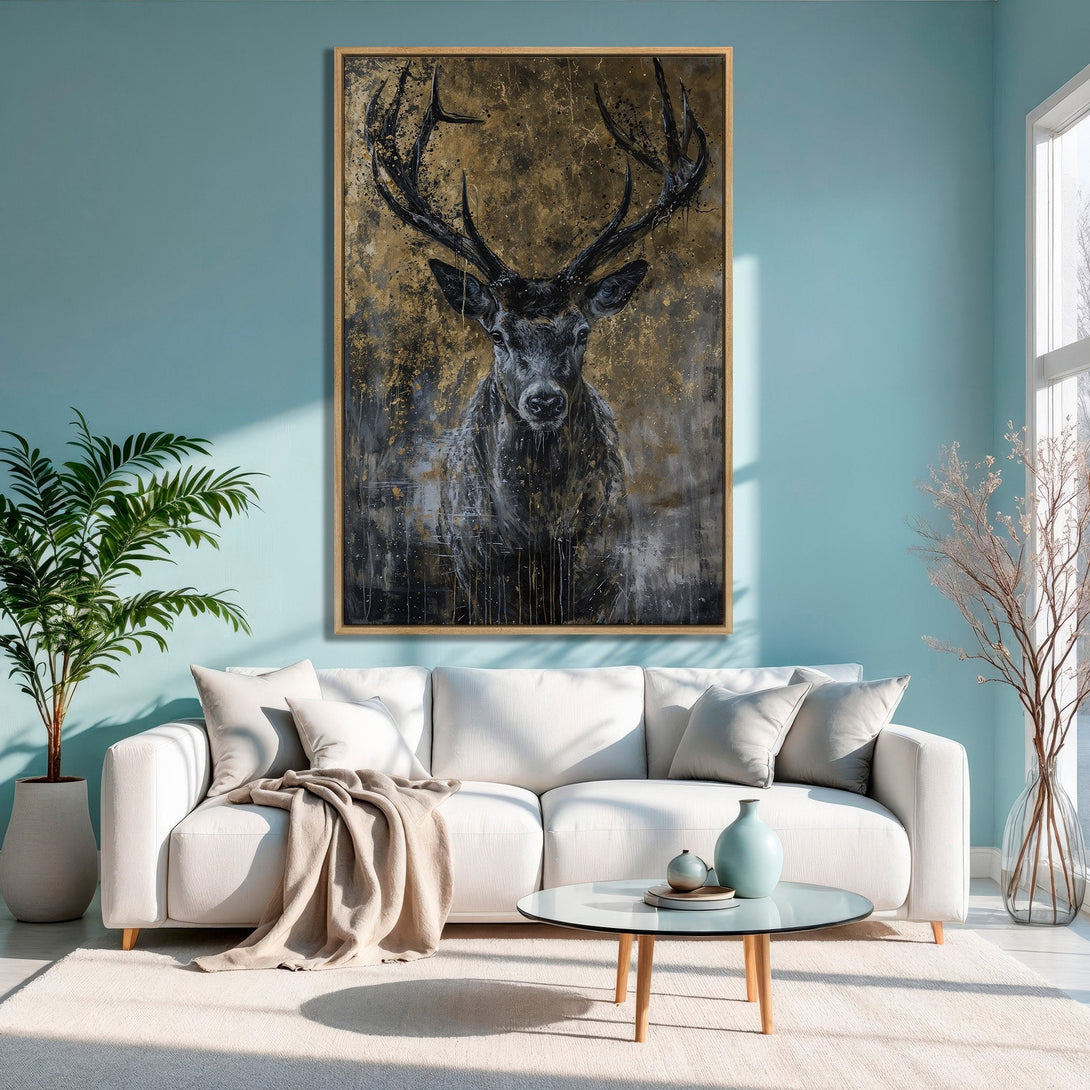 Framed Wall Art: Majestic deer portrait in black and gold, displayed in a modern living room with blue walls. Adds a touch of elegance.