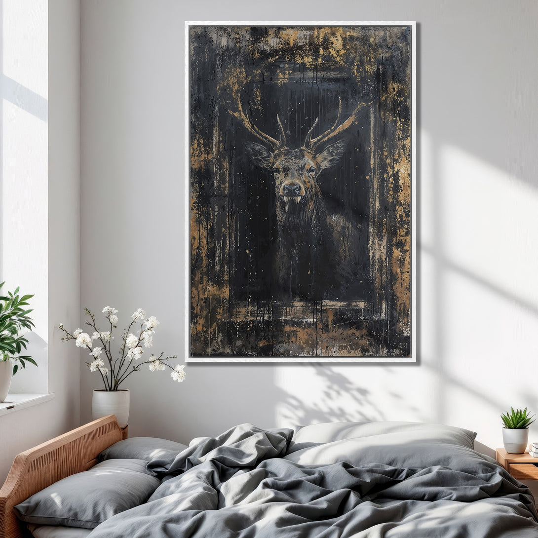 Framed Wall Art: Abstract deer portrait in black and gold, displayed in a bedroom. Modern canvas print with a dark, moody color palette.