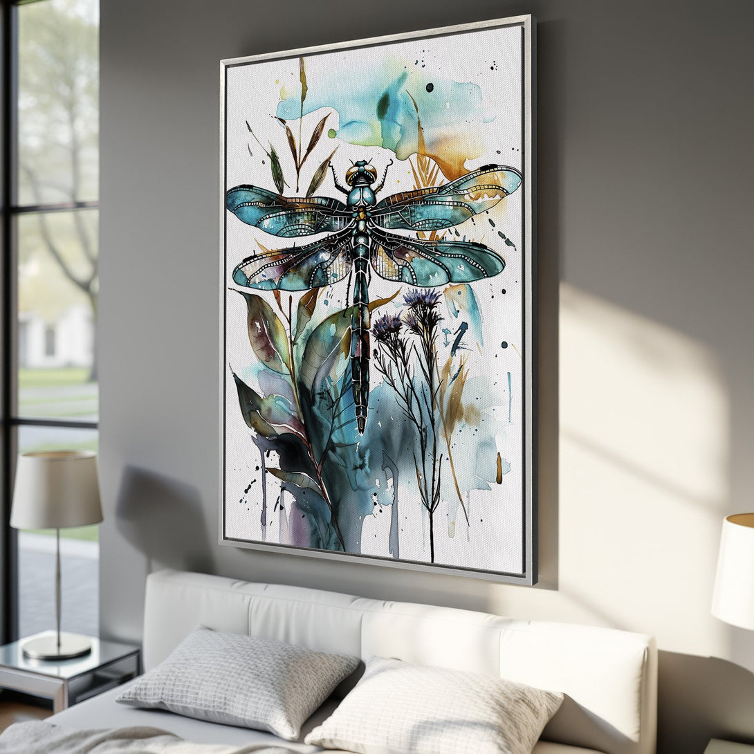 Framed Wall Art: Watercolor dragonfly print in blue & teal. Modern botanical art for home decor. Canvas print displayed in bedroom setting.