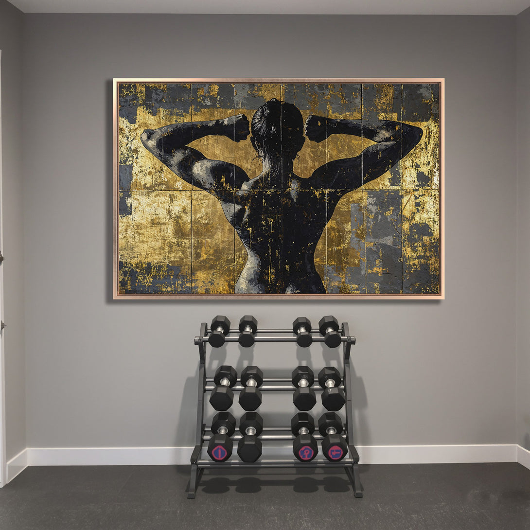 Framed Wall Art: Abstract figure in black and gold, displayed in a home gym. Modern art with a bold color palette. Elevate your space!