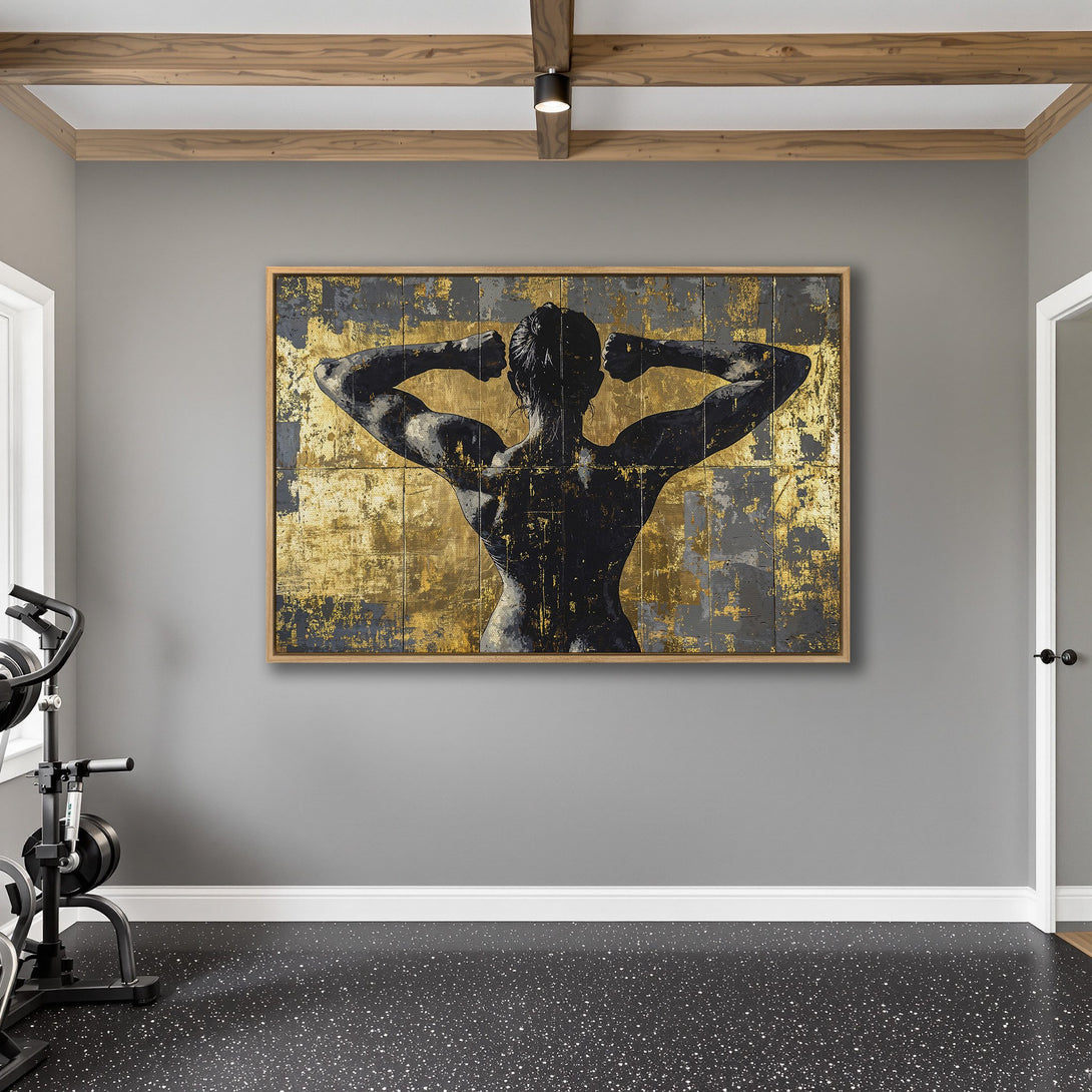 Framed Wall Art featuring a muscular figure with a gold and black abstract background. Modern art for your home gym.