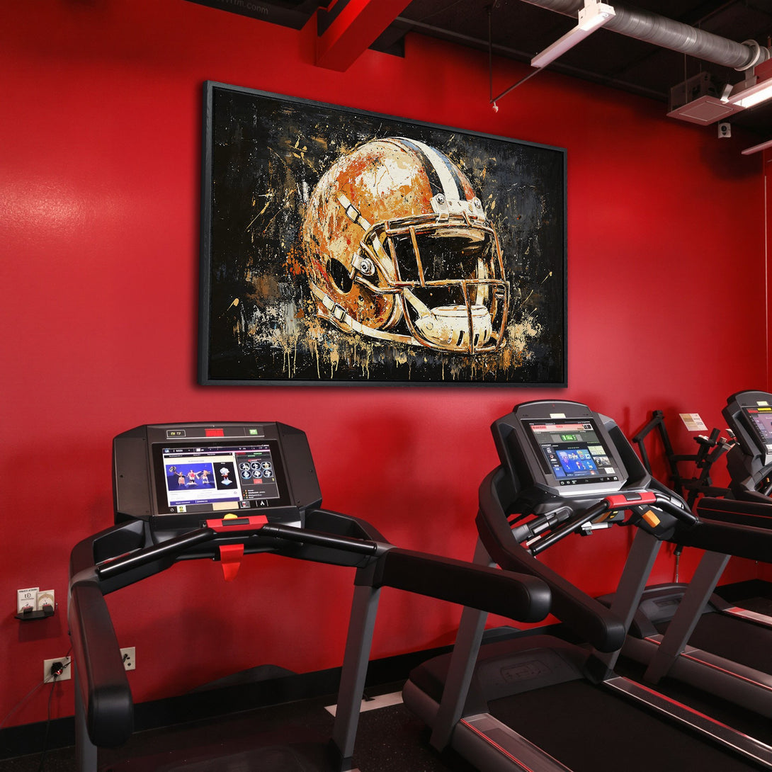 Framed Wall Art: Abstract football helmet art in a gym. Bold orange, black, and white color palette. Elevate your space with this statement piece.