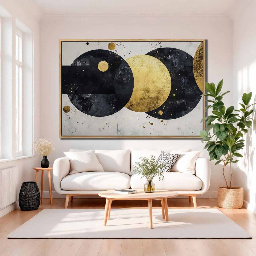 Framed Wall Art featuring abstract geometric design in black, gold, and white. Modern art canvas print adds a touch of elegance to any living room.