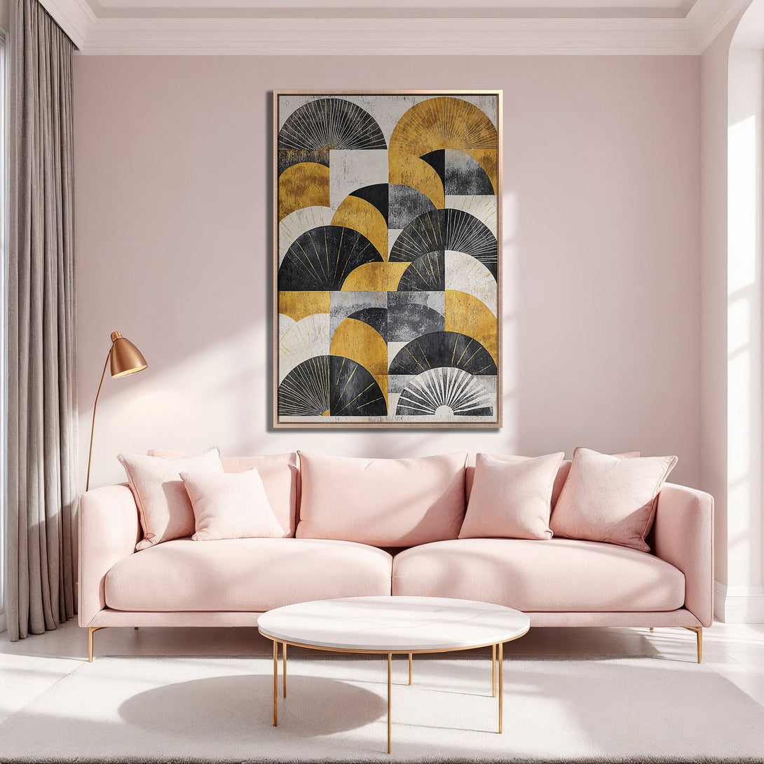 Framed Wall Art featuring an abstract fan design in gold, black, and white, displayed in a stylish, blush-toned living room.