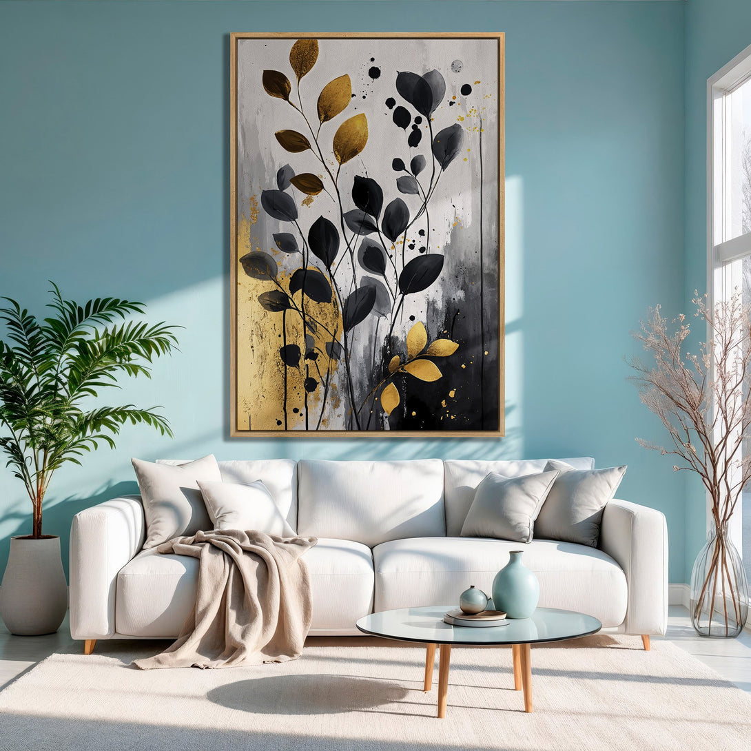 Framed Wall Art featuring abstract gold and black leaves. Modern art print with a neutral color palette, perfect for living room decor.