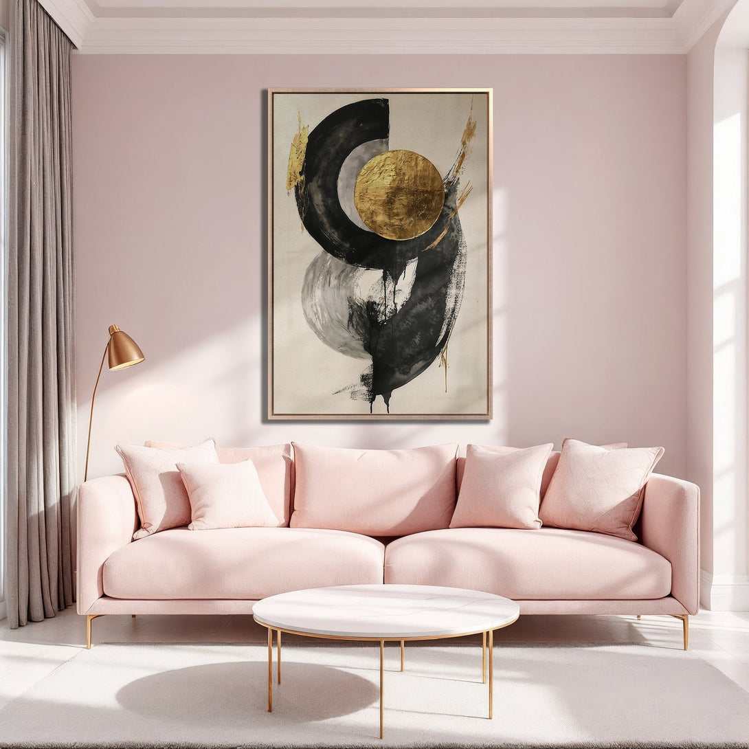 Framed Wall Art: Abstract black, gold, and gray art print in a modern living room with blush pink sofa. Stylish home decor.