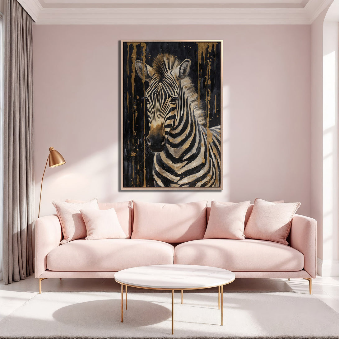Framed Wall Art: Zebra portrait with gold accents on black background, displayed in a pink interior. Modern, stylish decor with a neutral color palette.