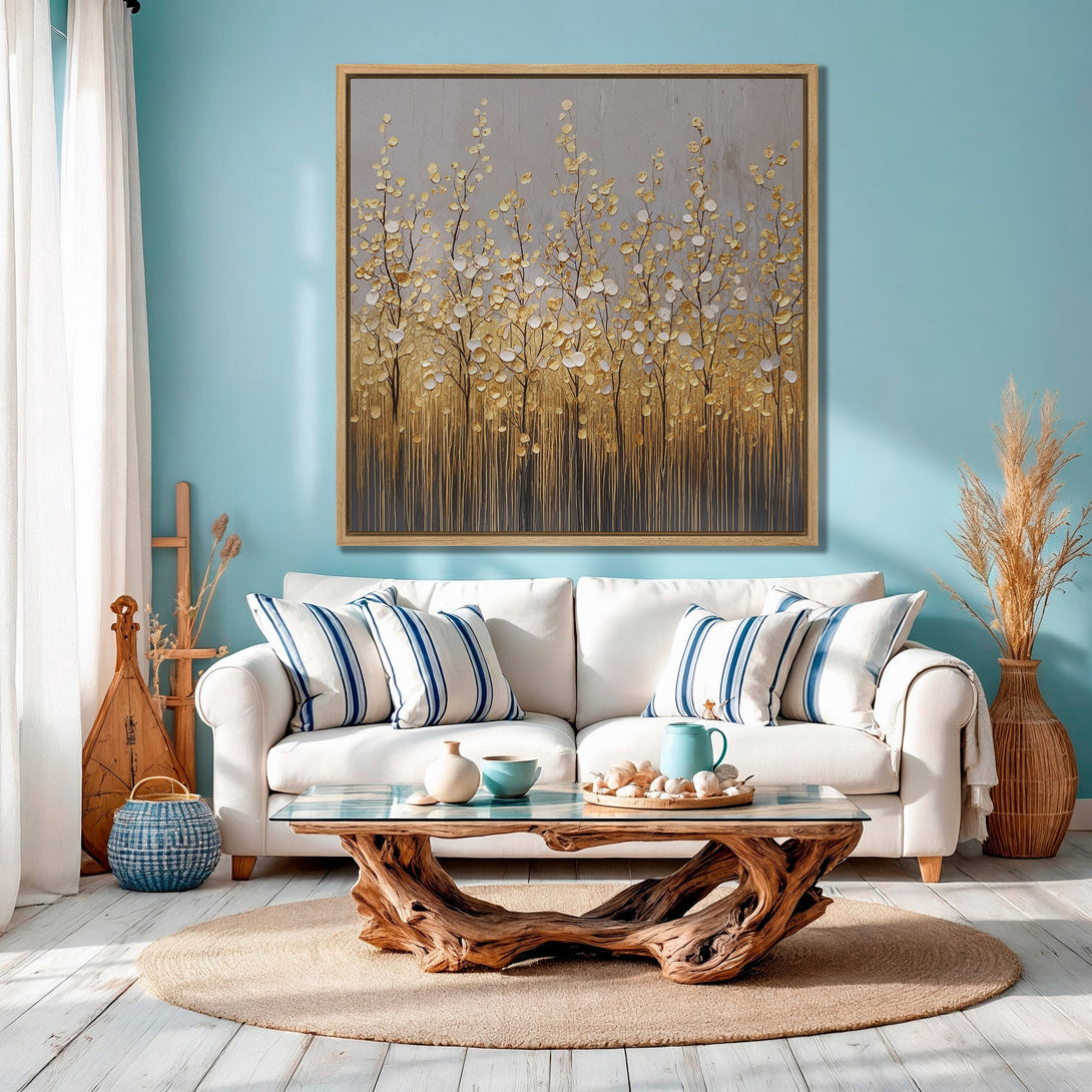 Framed Wall Art featuring a gold and gray abstract floral design. Modern, elegant decor in a serene blue, white, and gold color palette. Perfect for living room inspiration.