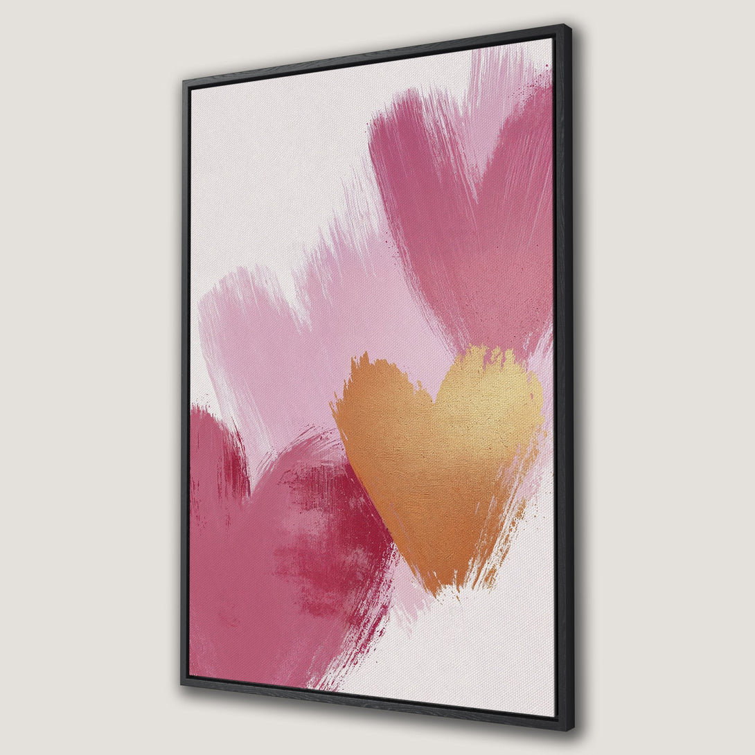 Framed Wall Art featuring abstract hearts in pink and gold brushstrokes. Modern canvas print for a stylish home decor upgrade.