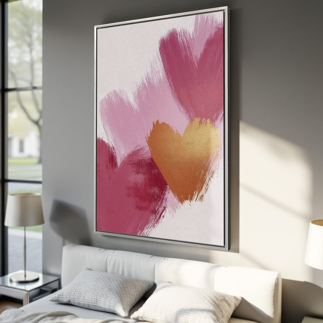 Framed Wall Art: Abstract heart canvas print in pink and gold. Modern art for bedroom decor. Adds a touch of love and style to any space.