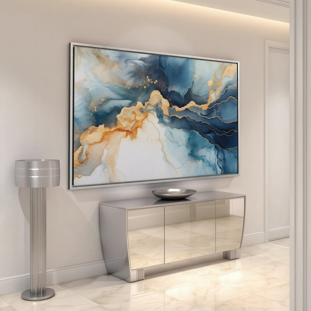 Framed Wall Art featuring an abstract blue, gold, and orange design, displayed in a modern interior. Elevate your space with this stunning Canvas Print!