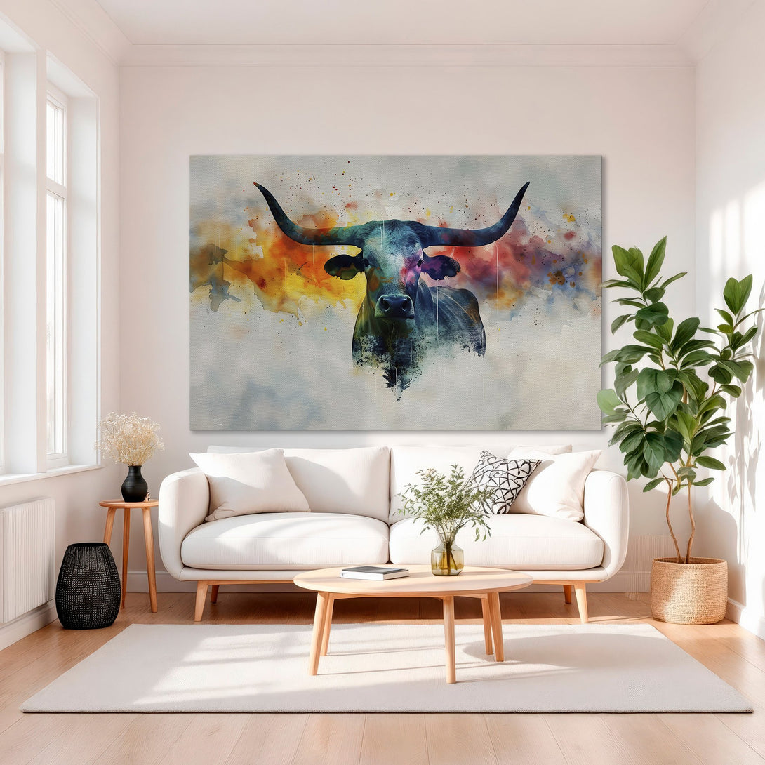 Framed Wall Art: Watercolor longhorn canvas print in a modern living room. Features a vibrant, colorful palette of blues, oranges, and yellows.