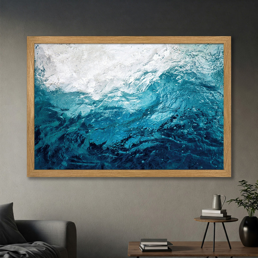 Framed Poster featuring abstract ocean waves in shades of blue and white. Coastal art print to bring tranquility to your space.