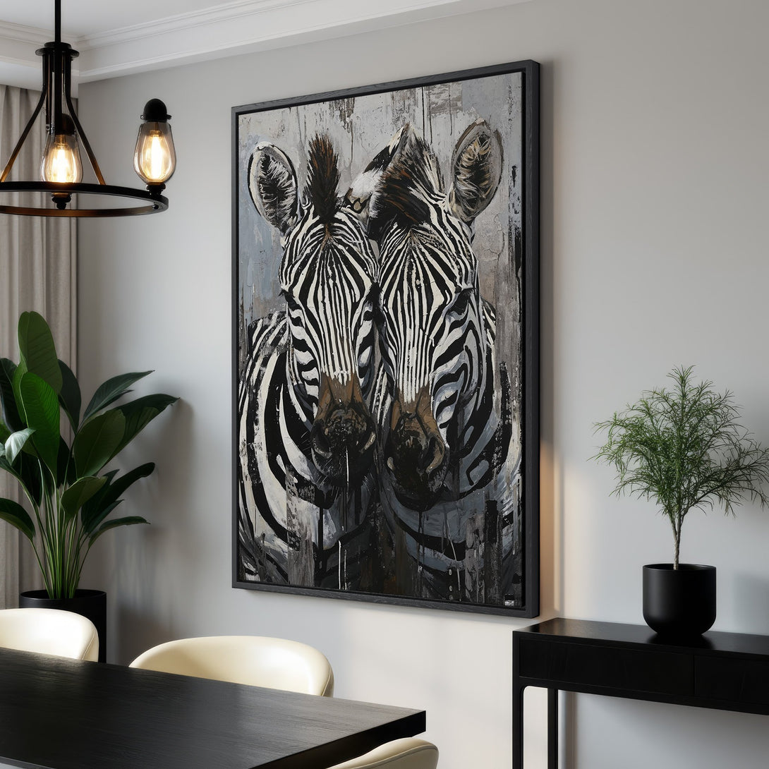 Framed Wall Art featuring two zebras in an abstract style with a black, white, and gray color palette. Perfect for modern home decor.
