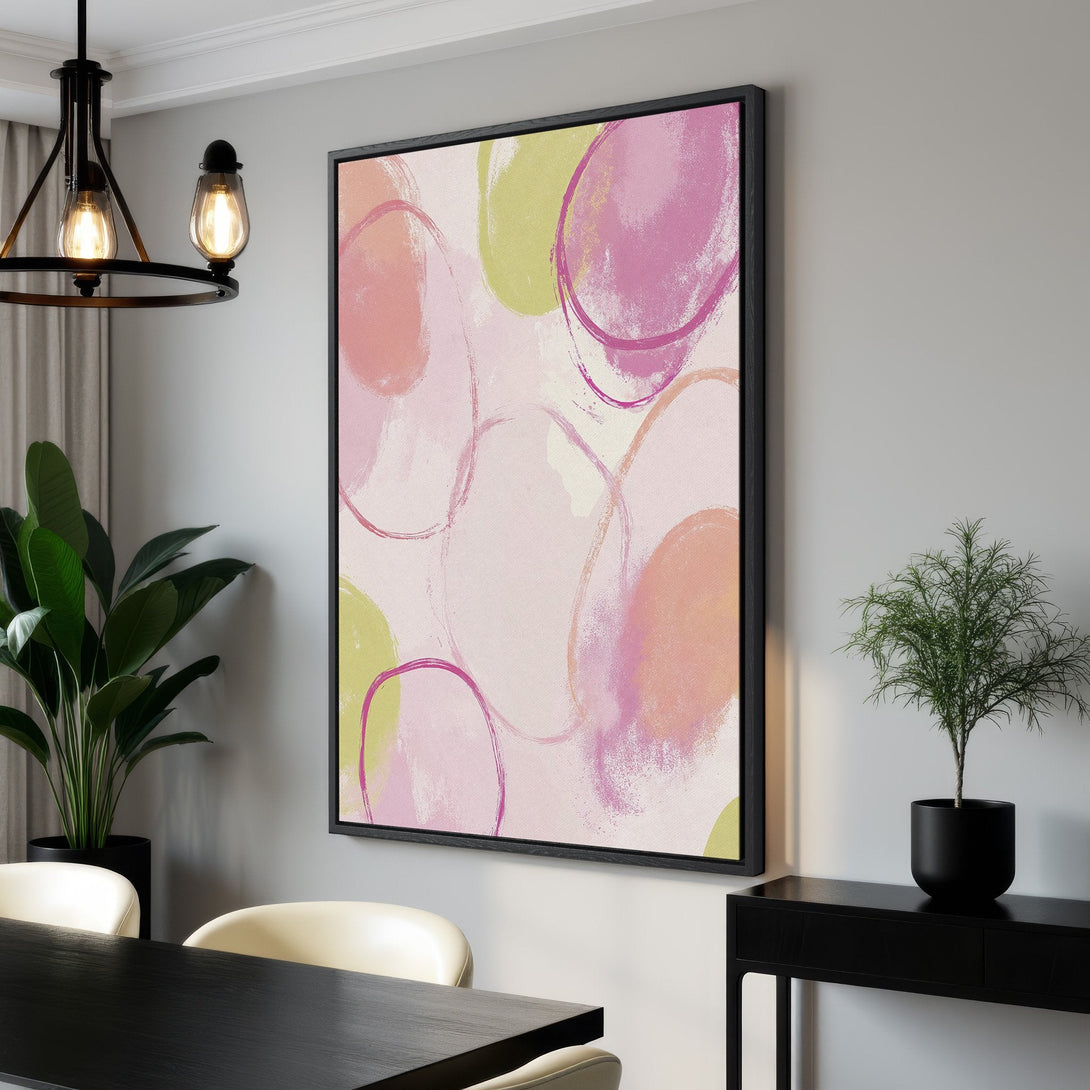 Framed Wall Art featuring abstract pink, peach, and green circles. Modern canvas print adds a pop of color to any interior. Shop now!