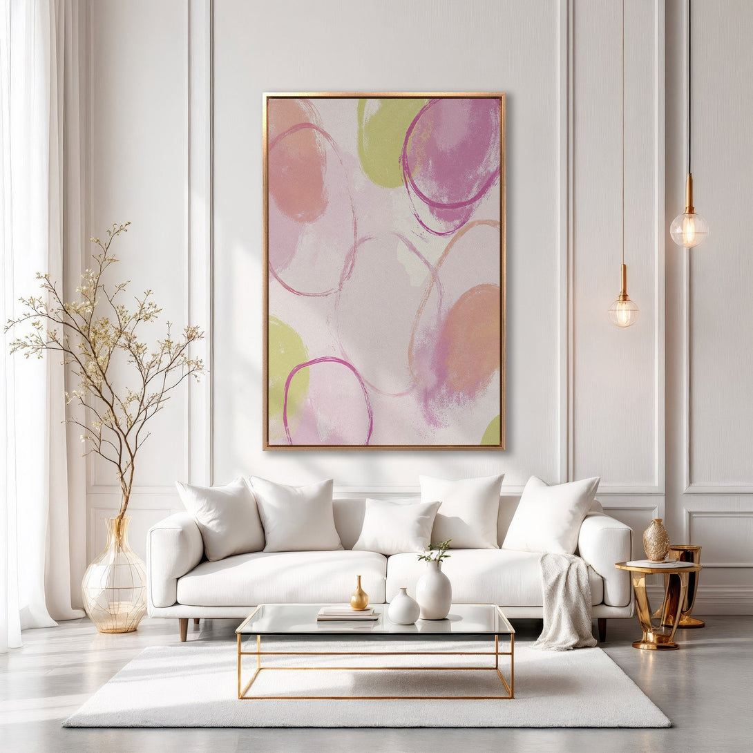Framed Wall Art: Abstract circles in pink, peach, and green. Modern art canvas print adds a pop of color to a chic, neutral living room.