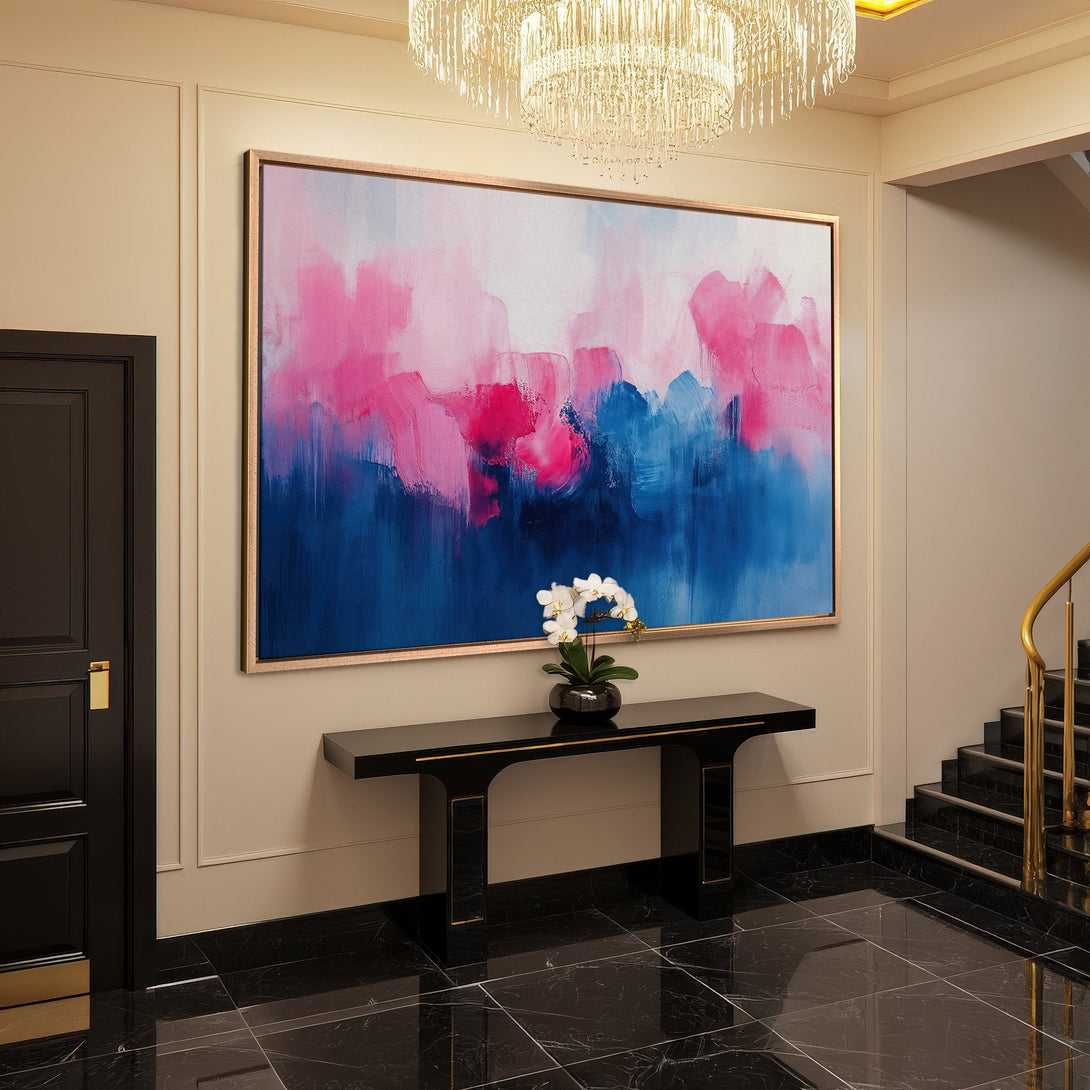 Framed Wall Art: Abstract pink and blue canvas print adds a pop of color to a modern entryway. Perfect for living room decor.
