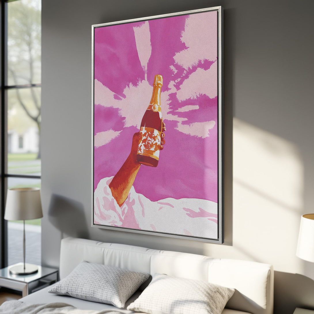 Framed Wall Art: Pop art style Canvas Print of a hand holding champagne bottle against a pink sky. Perfect for adding a splash of color to your home!