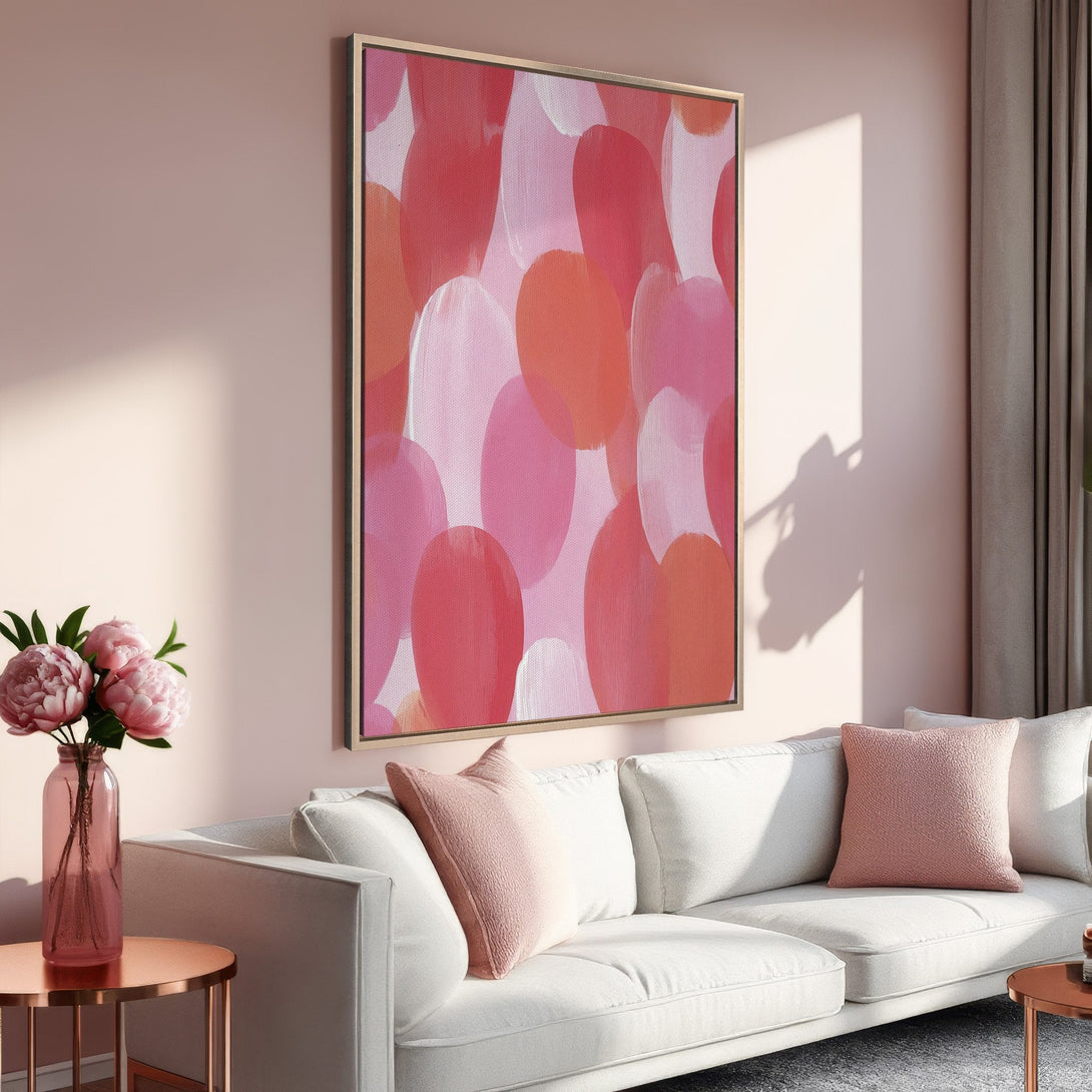 Framed Wall Art featuring abstract brushstrokes in pink and coral hues. Modern art perfect for adding a pop of color to your living room.