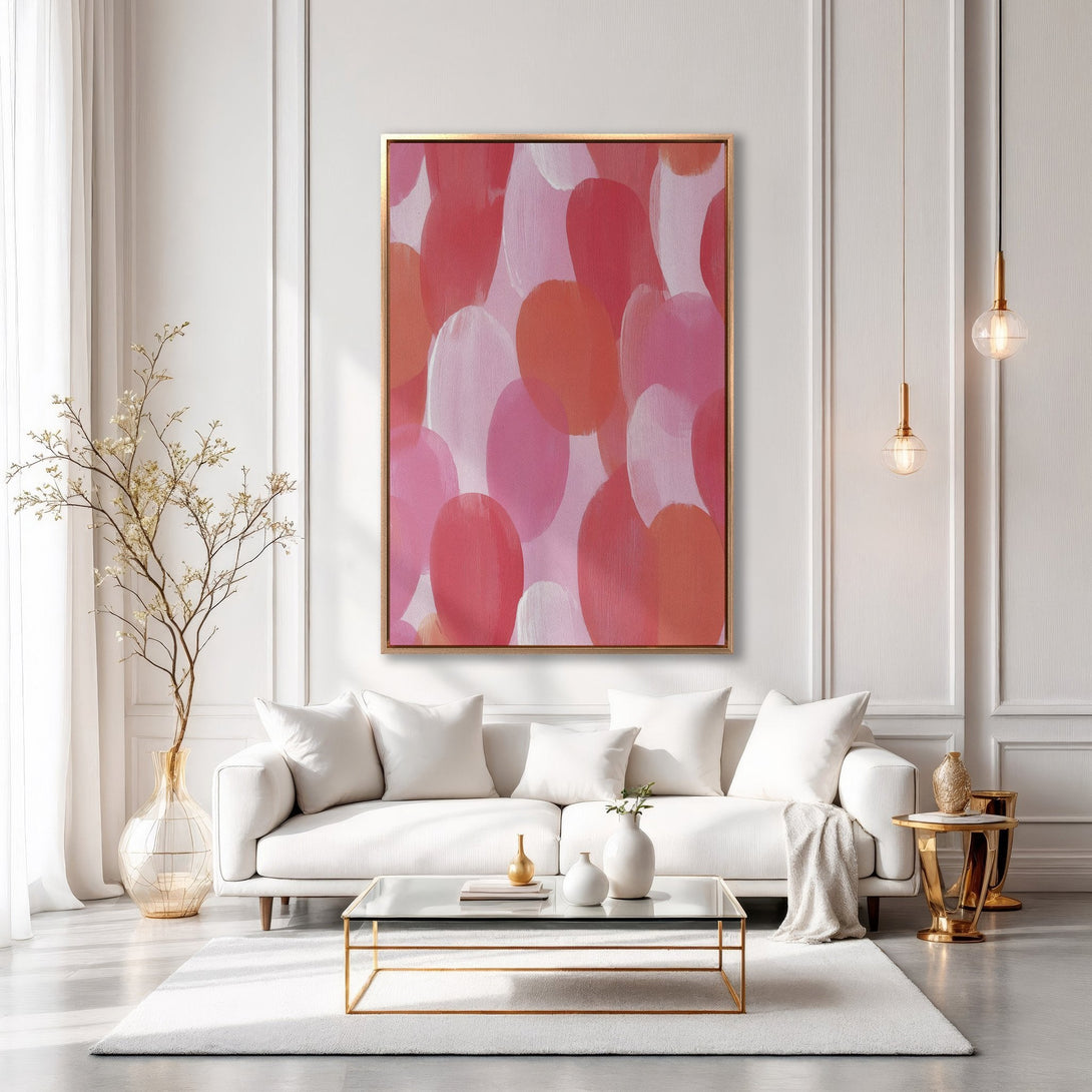 Framed Wall Art: Abstract pink and coral brushstroke design. Modern art canvas print adds a pop of color to a stylish living room.