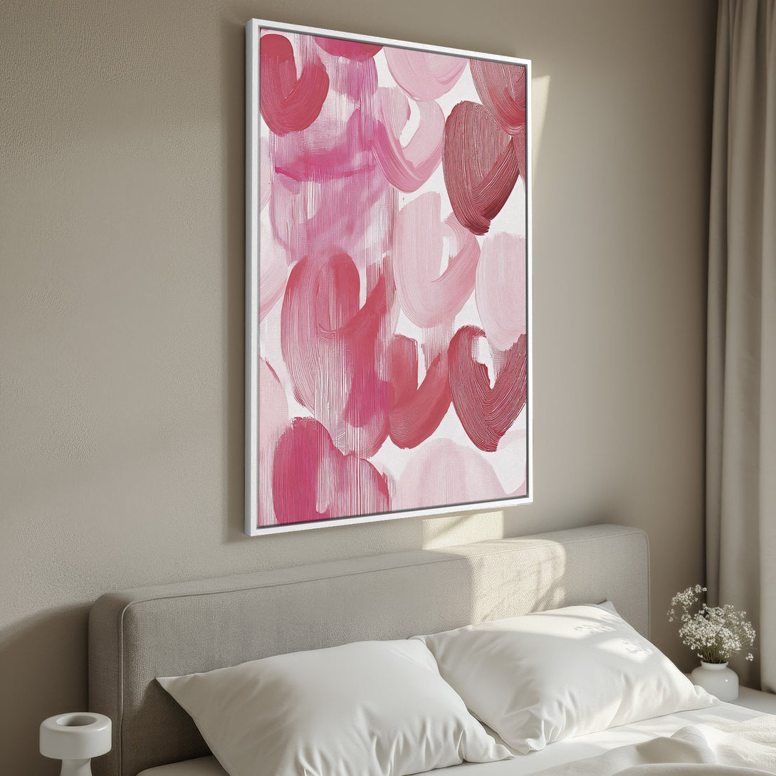 Framed Wall Art: Abstract pink brushstroke canvas print. Modern art in a bedroom with a blush and red color palette. Perfect home decor accent.