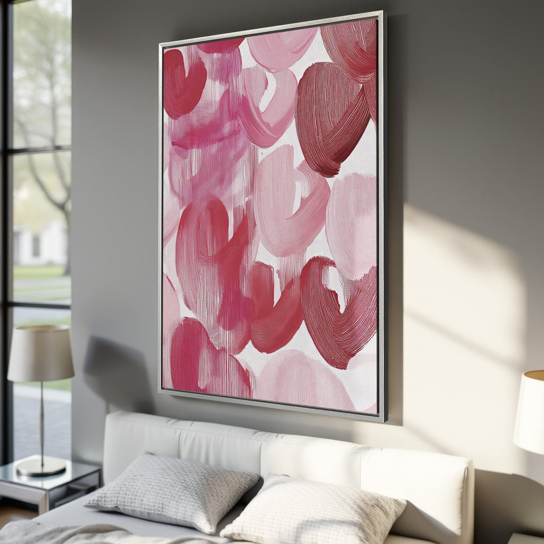 Abstract Canvas Print in a bedroom. Features pink and red brushstrokes. Modern art for home decor.