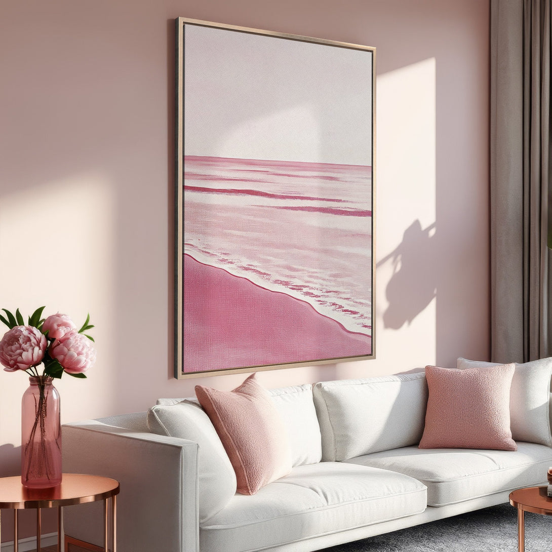 Framed Wall Art: Pink beach scene canvas print in a modern interior. Coastal art with a blush and rose color palette, perfect for adding a touch of elegance.