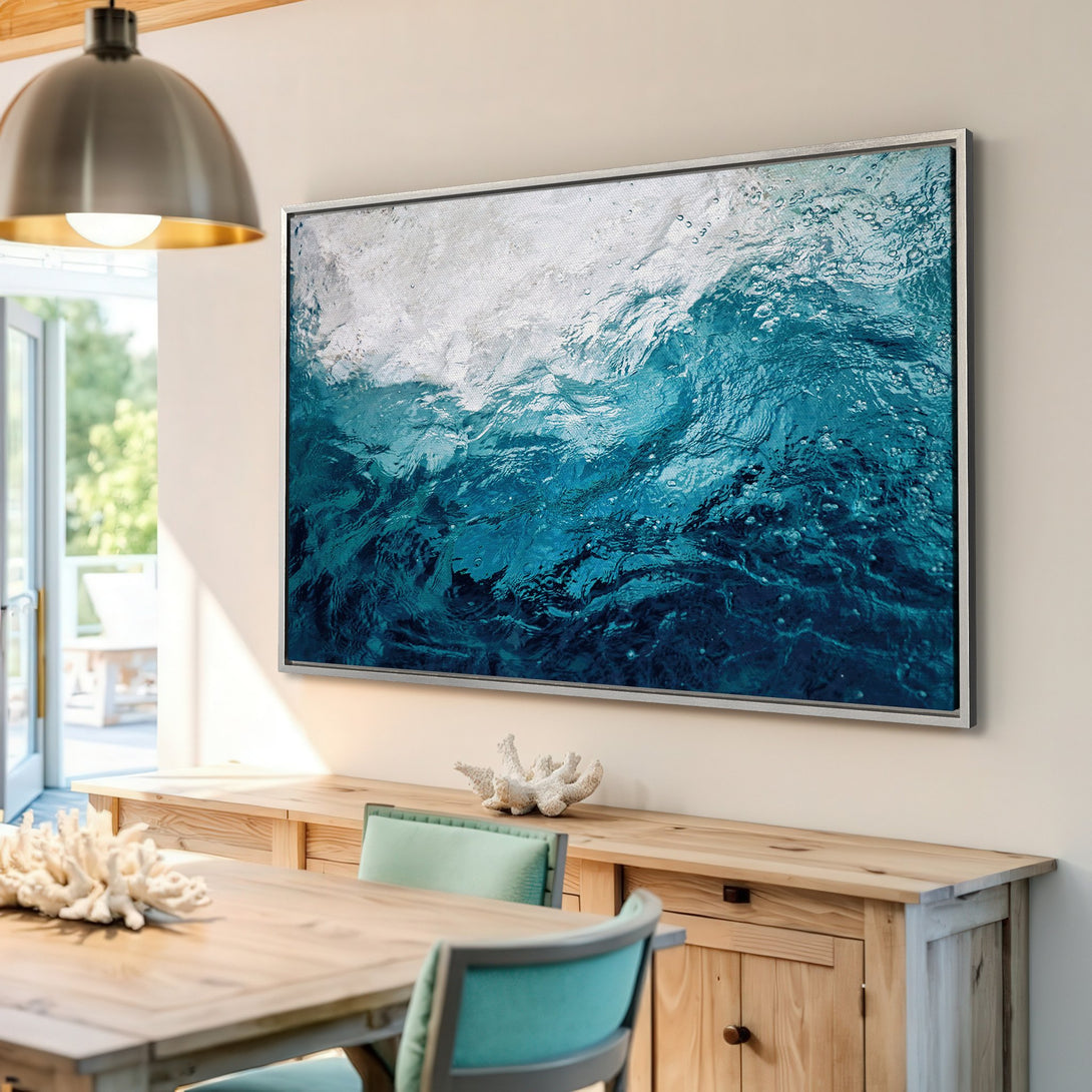 Framed Wall Art of ocean waves in shades of blue. Coastal style Canvas Print adds a calming touch to any room.