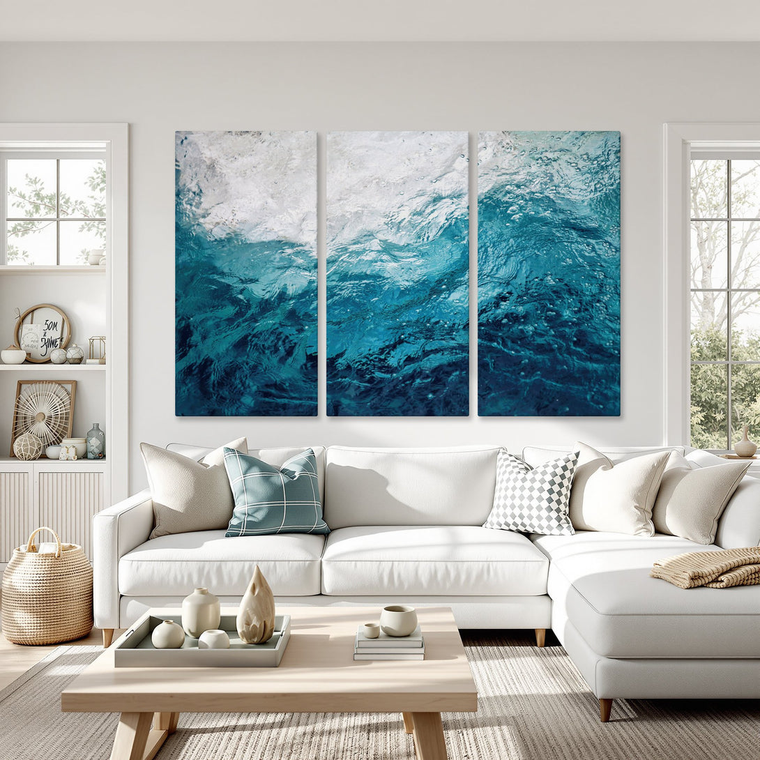 Canvas Print of ocean waves in shades of blue, displayed in a modern living room. Coastal-inspired wall art for a calming aesthetic.