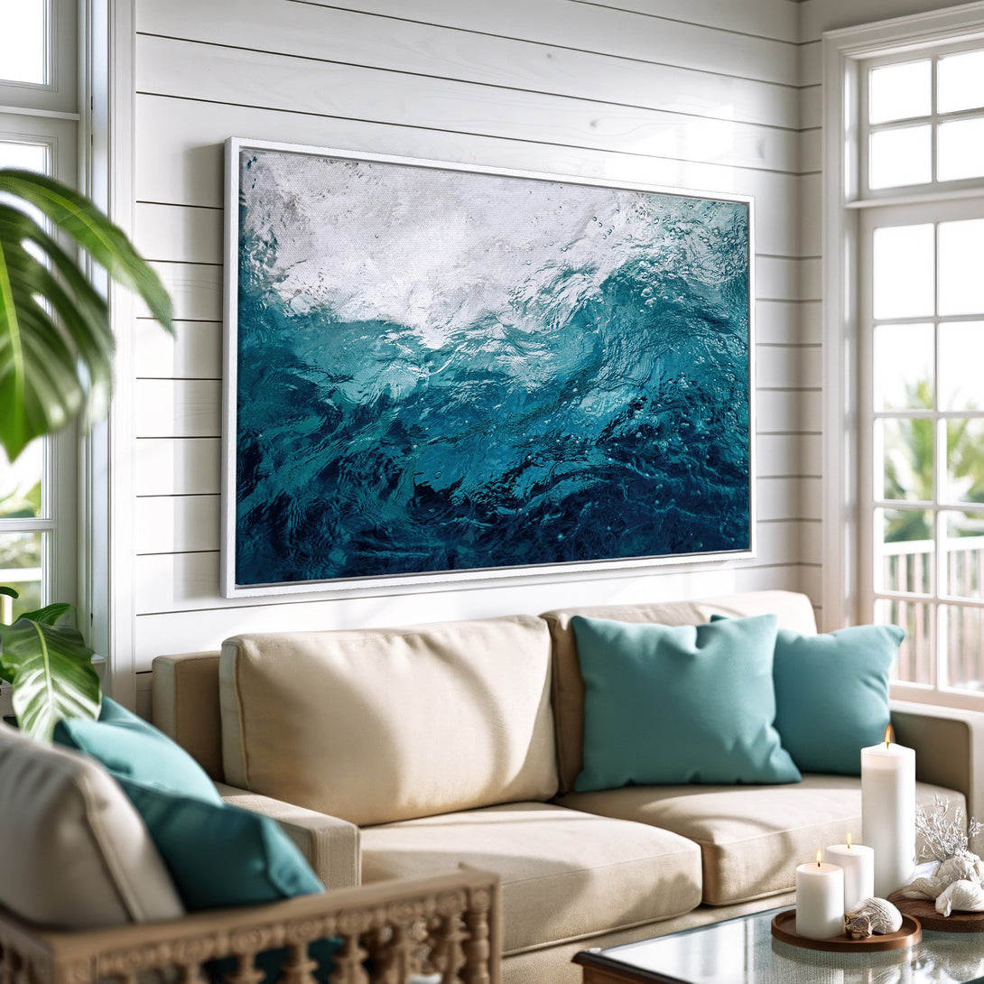 Framed Wall Art: Abstract ocean waves canvas print in teal and white. Coastal living room decor with a calming, modern style.