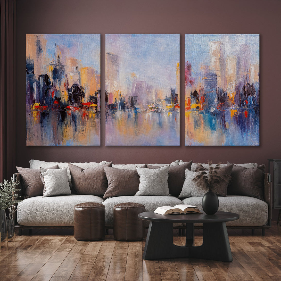 Abstract cityscape Canvas Print in a modern interior. Features a vibrant palette of blues, oranges, and purples, adding a touch of artistic flair.