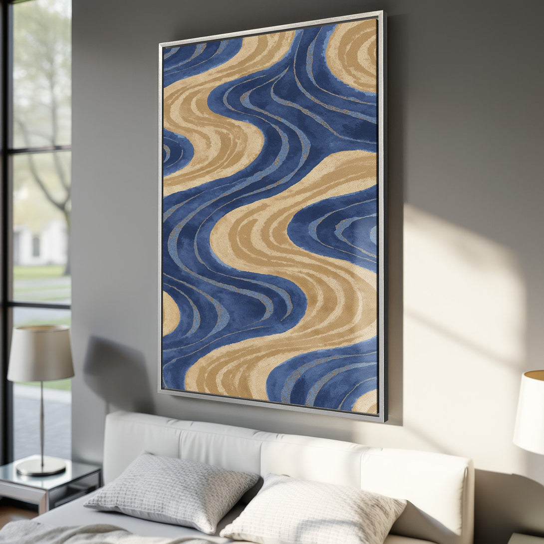 Framed Wall Art featuring abstract blue and beige waves. Modern art print with a calming color palette, perfect for bedroom decor.