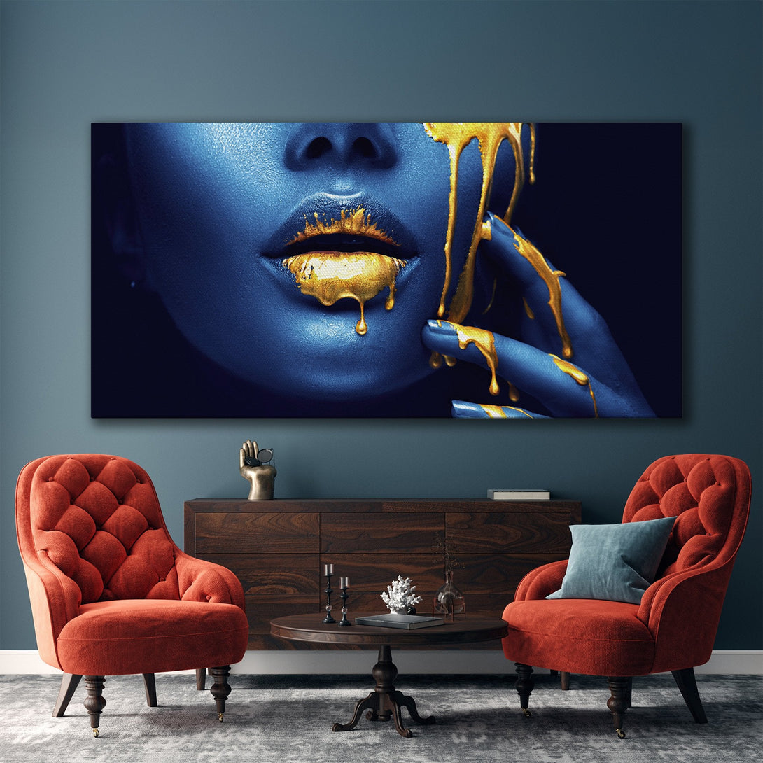 Framed Wall Art featuring a woman's face with dripping gold paint. Modern art in a blue and gold color palette, perfect for home decor.