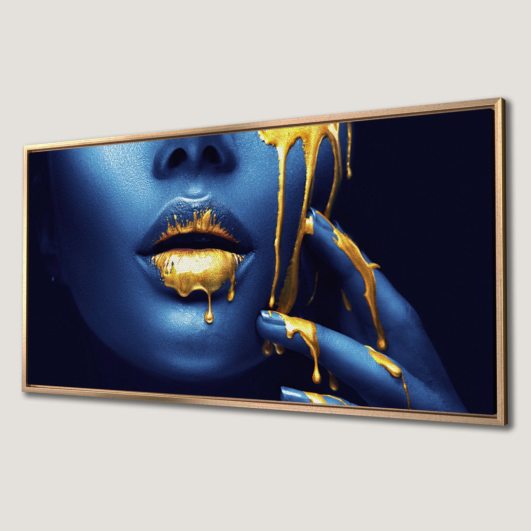 Framed Wall Art: Stunning blue face with dripping gold paint. Modern art piece with a bold, luxurious color palette. Perfect for home decor.