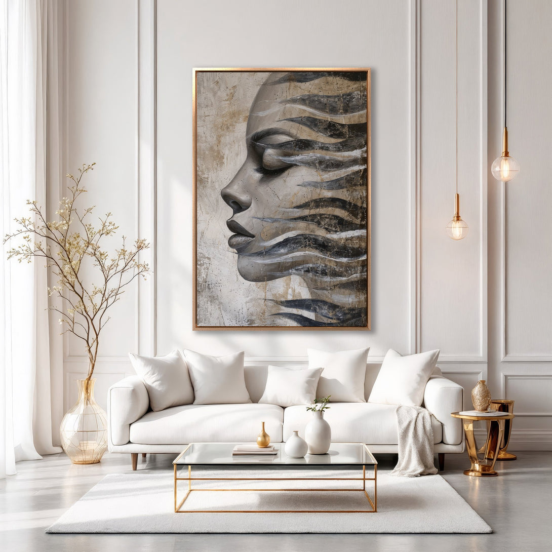 Framed Wall Art featuring a serene woman's face in neutral tones. Modern abstract art with a gold frame, perfect for adding elegance to any interior.