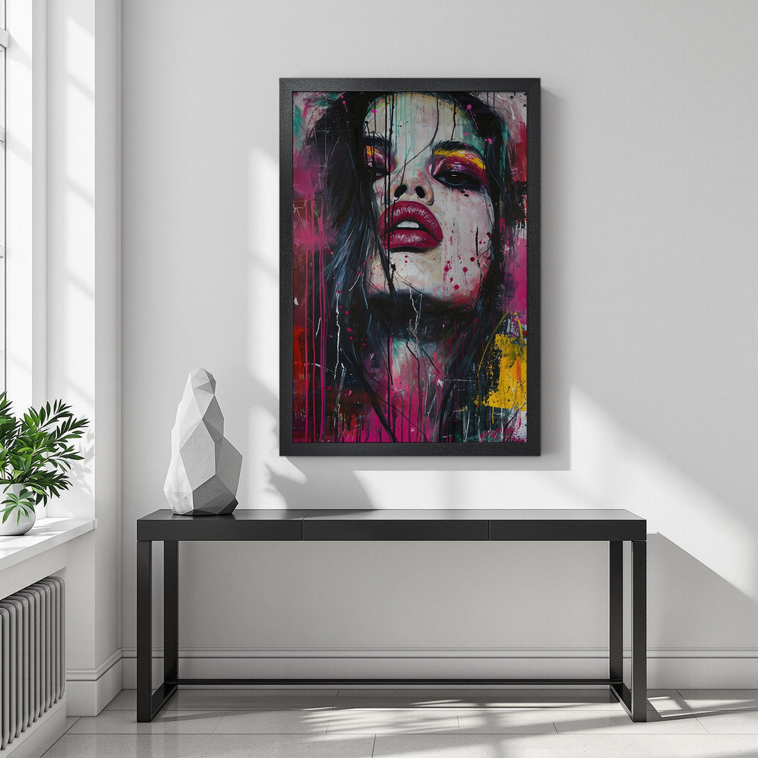 Framed Poster featuring a woman's face in vibrant, abstract style with a pink, yellow, and black color palette. Modern wall art decor.