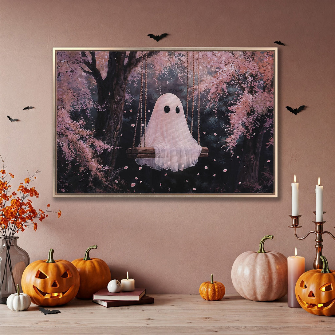 Framed Wall Art featuring a whimsical ghost on a swing in a pink floral forest. Perfect Halloween decor with a soft, dreamy color palette.