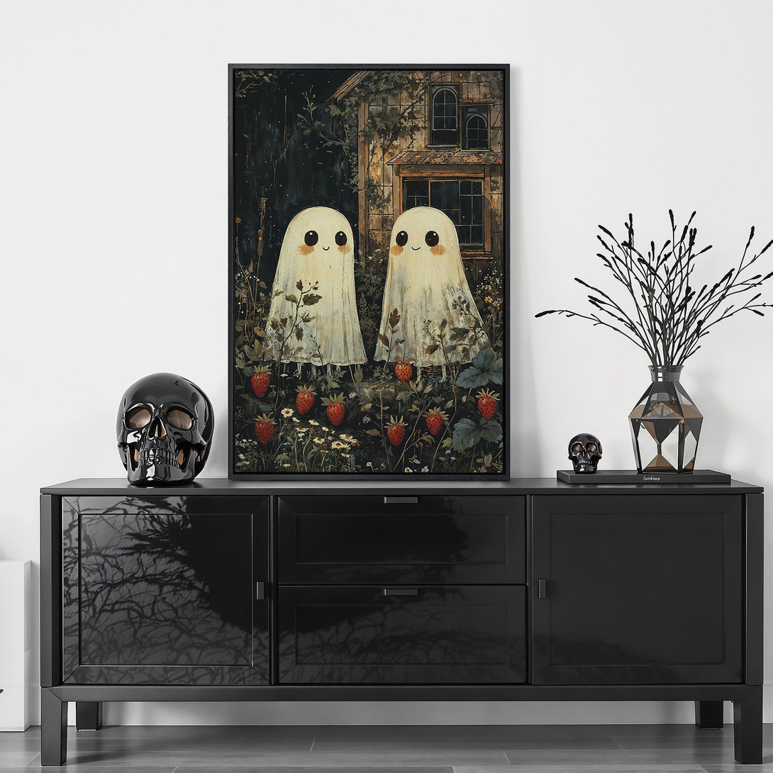 Framed Wall Art: Whimsical ghost art with a dark, moody aesthetic. Features a black frame, a muted color palette, and a touch of spooky charm for stylish home decor.