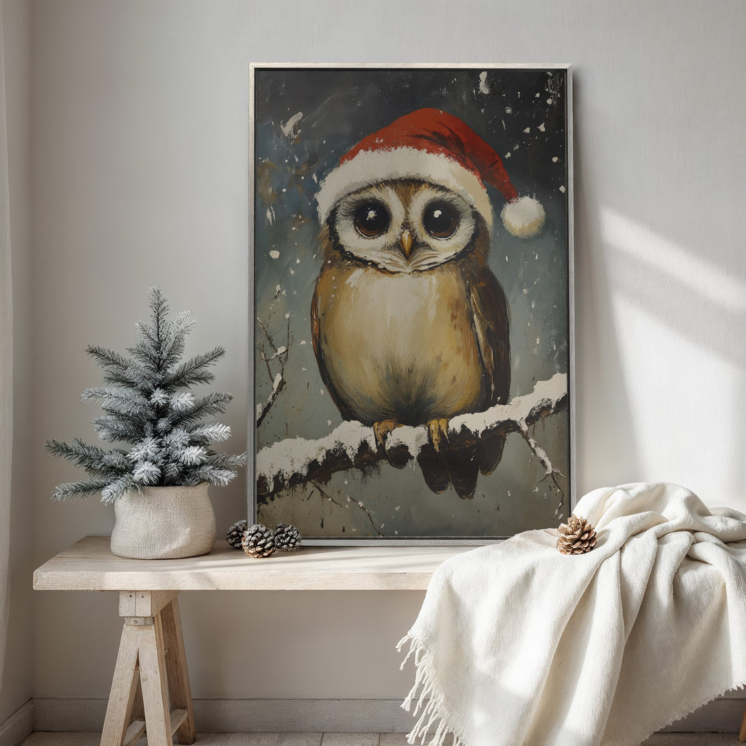 Framed Wall Art: Charming owl in Santa hat, painted in a whimsical style with a cozy, neutral color palette. Perfect Christmas decor!