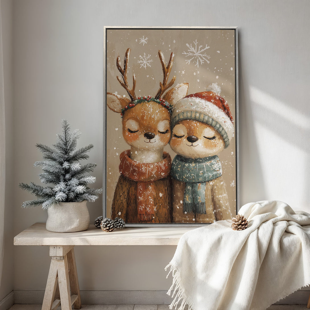 Framed Wall Art featuring two adorable deer in winter attire. Warm, cozy color palette with browns, oranges, and greens. Perfect for holiday decor & adding charm to any room.