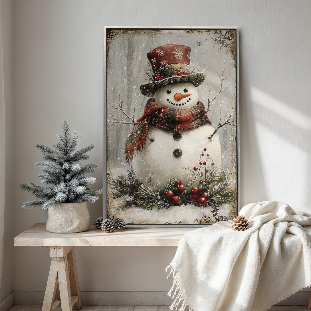 Framed Wall Art featuring a charming snowman in a winter scene. Rustic style with a warm, inviting color palette of reds, greens, and whites. Perfect holiday decor!