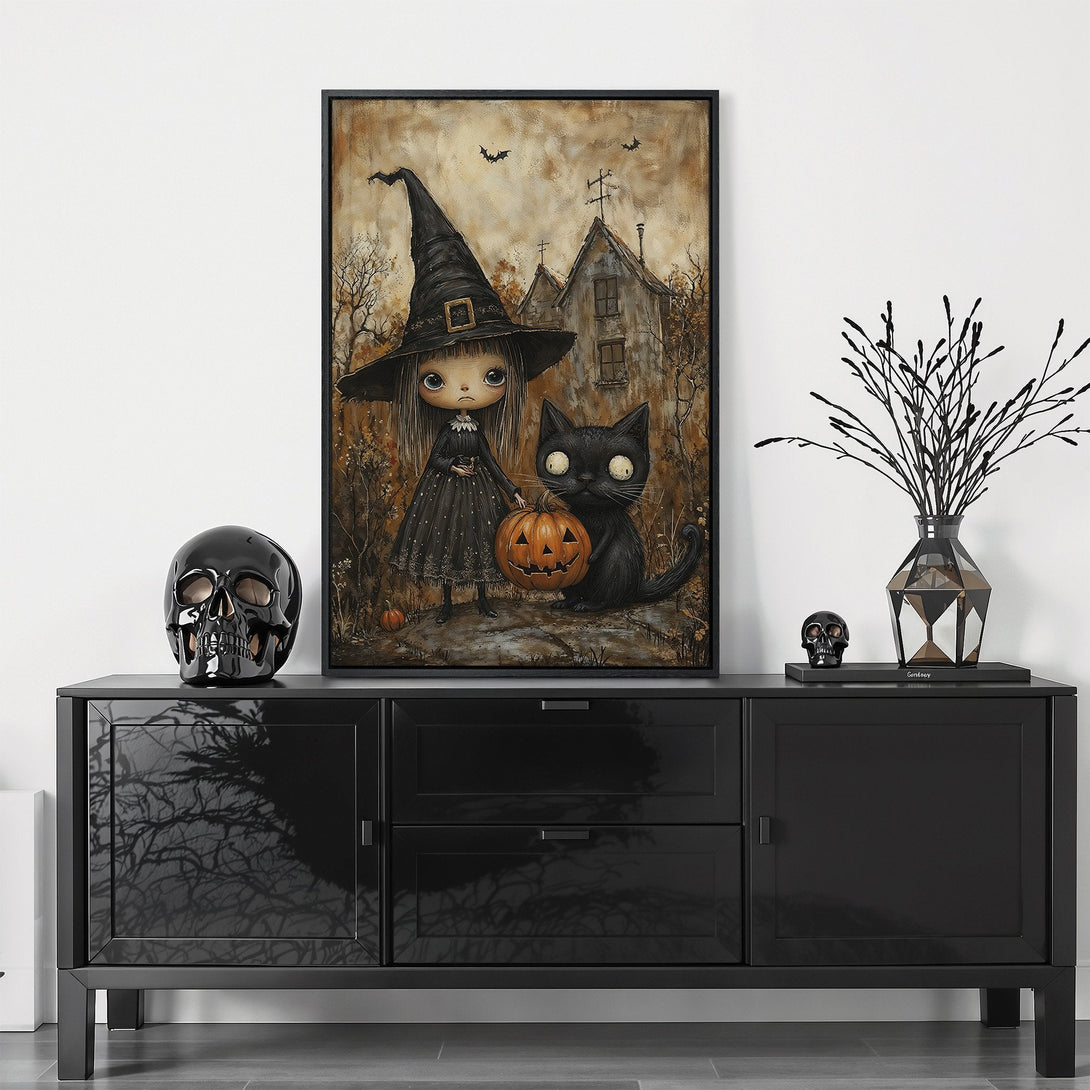 Framed Wall Art: Spooky Halloween scene with witch, black cat, and pumpkin. Earthy tones with black frame. Perfect for adding a touch of Halloween charm!