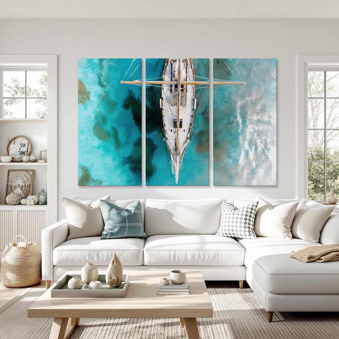 Canvas Print of a sailboat in turquoise waters. Coastal art in a modern living room, featuring a calming blue and white color palette.