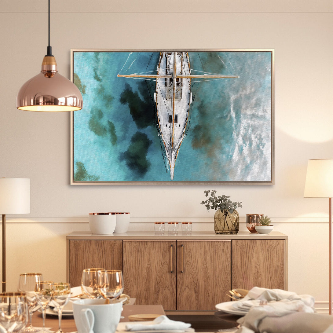 Framed Wall Art: Aerial view of a sailboat on turquoise water. Coastal style Canvas Print with blue, white, and tan color palette.
