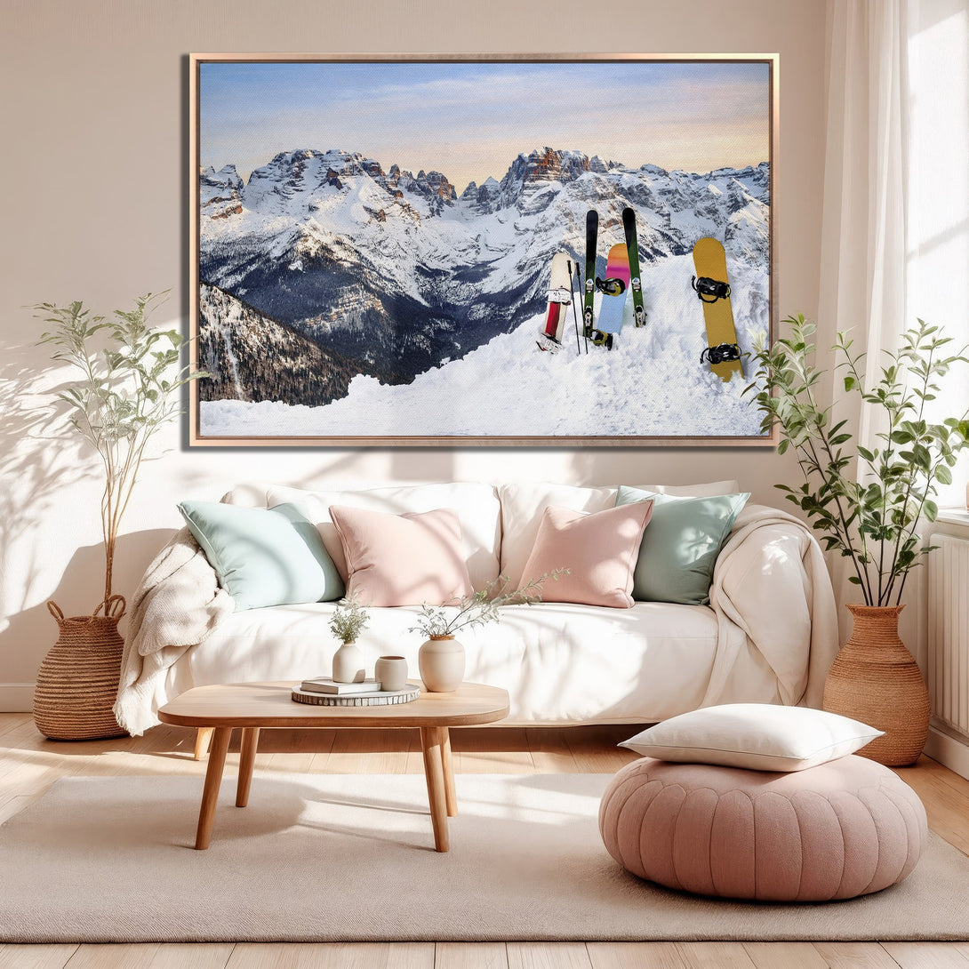 Framed Wall Art featuring a stunning mountain landscape with skis & snowboard. Neutral color palette, perfect for adding a touch of adventure to your home decor.