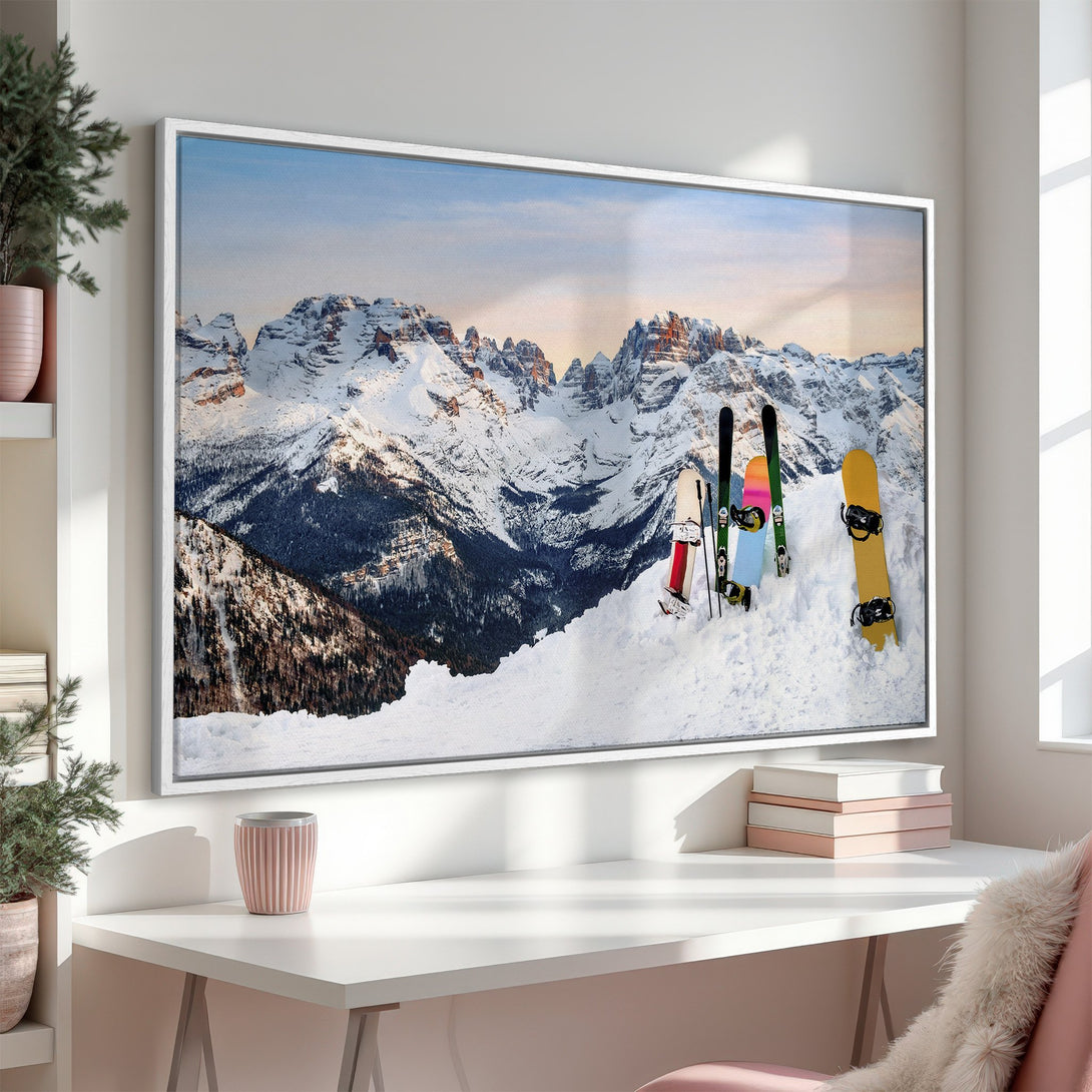 Framed Wall Art featuring a stunning mountain landscape with snowboards and skis. Earthy tones of white, blue, and brown create a serene, wintery vibe. Perfect for your home!