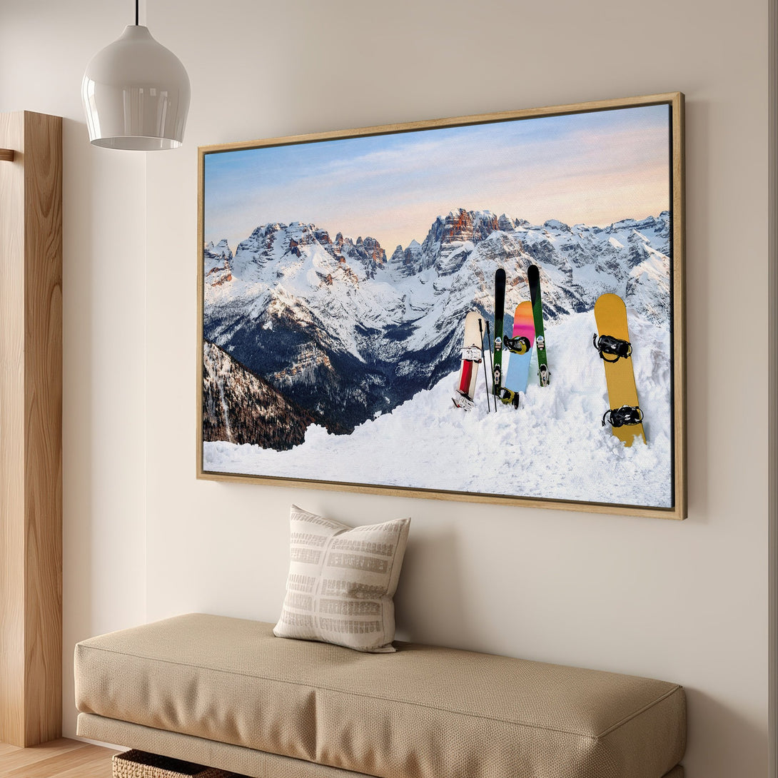 Framed Wall Art: Snowy mountain landscape Canvas Print with skis & snowboards. Neutral tones with pops of color, perfect for modern home decor.