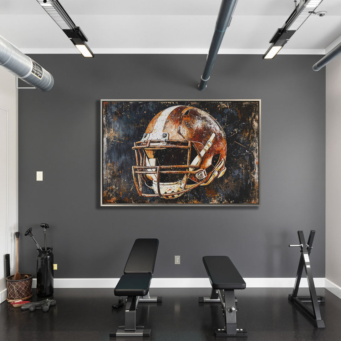 Framed Wall Art of a football helmet in a modern style. Features a rustic, distressed look with a warm, earthy color palette. Perfect for any sports fan!