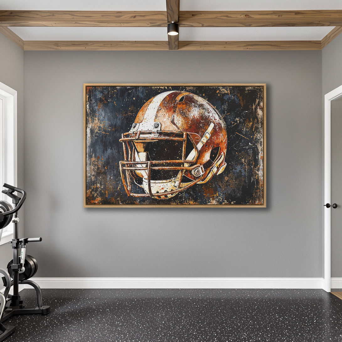 Framed Wall Art: Abstract football helmet art in rustic orange and navy blue. Perfect for a sports-themed home gym or man cave.